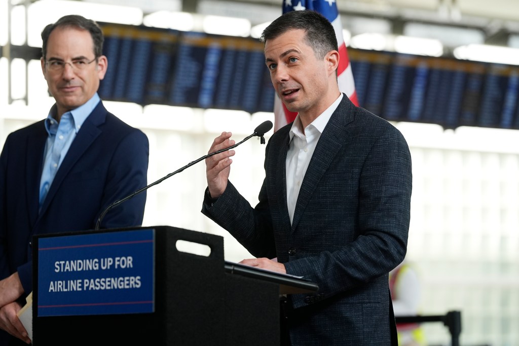 U.S. Transportation Secretary Pete Buttigieg, right, speaks as Colorado Attorney General Phil Weiser listens during a news conference to announce a new partnership that will streamline how consumer complaints against airlines are resolved in the terminal at Denver International Airport Tuesday, April 16, 2024, in Denver.