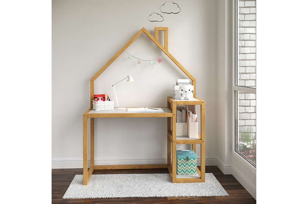 A desk with shelves and a lamp