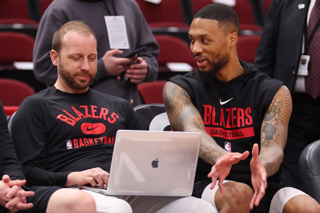 Steve Hetzel talks with Damian Lillard in 2023 while an assistant with the Portland Trail Blazers. 