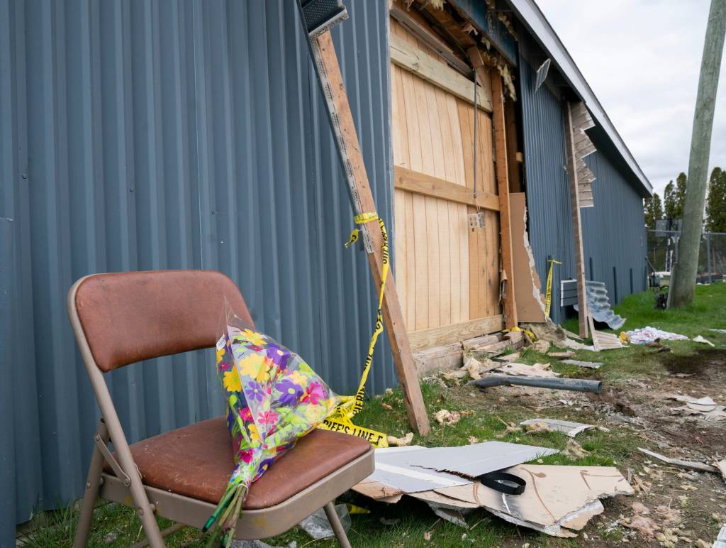 Flowers were left at a scene on Sunday, April 21, 2024 where an alleged drunk driver smashed through a wall at the Swan Boat Club.