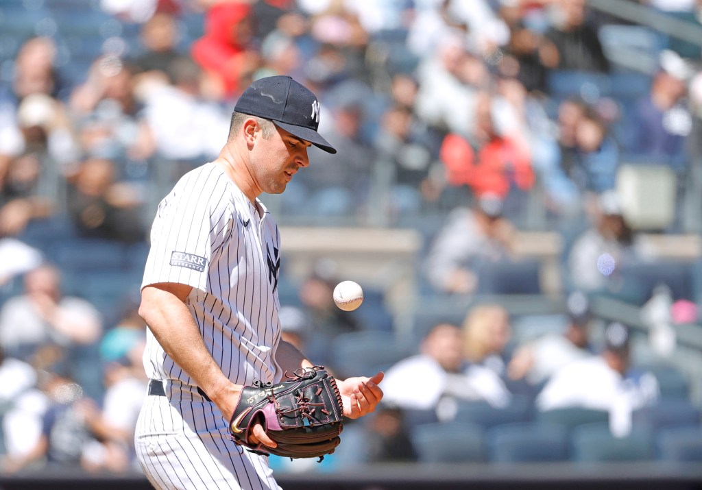 Carlos RodÃ³n #55 of the New York Yankees reacts on the mound after he balks during the first inning.