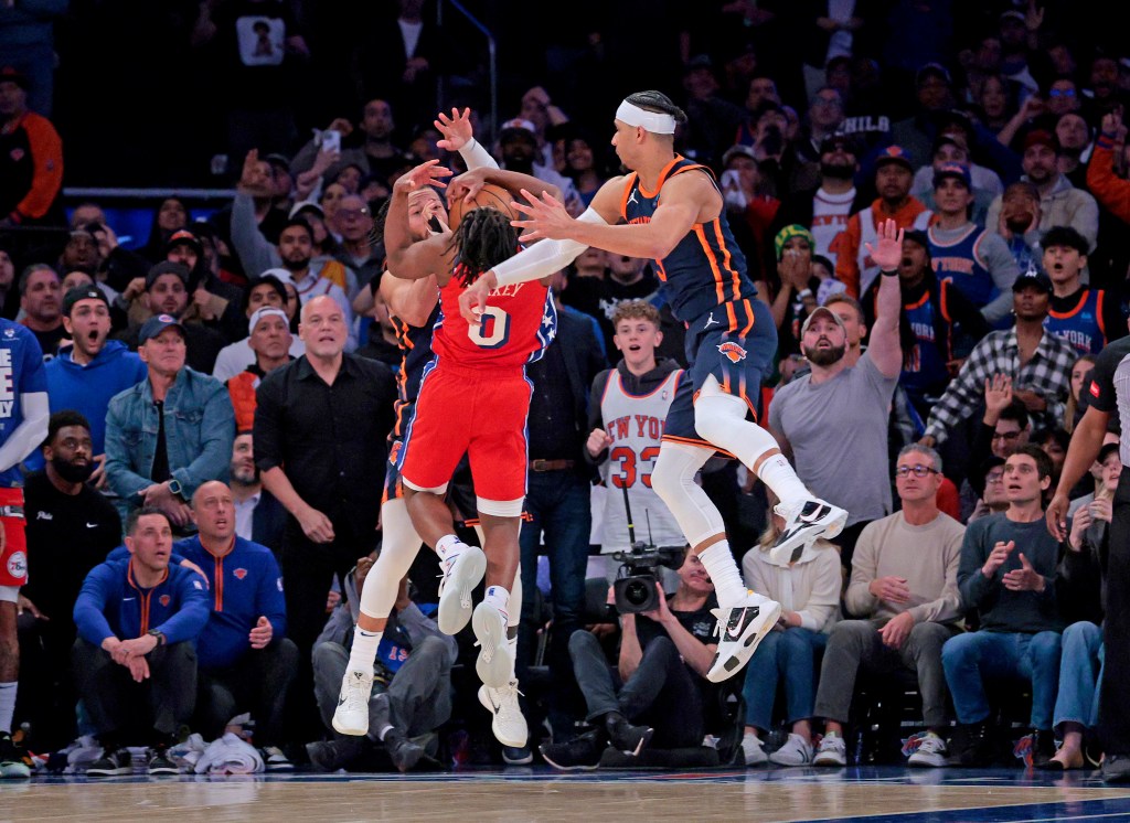 Tyrese Maxey looses the ball as New York Knicks guard Josh Hart #3 and New York Knicks guard Jalen Brunson #11, defend in the closing seconds of the game.