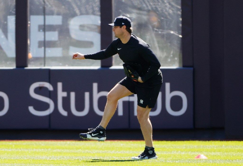 Yankees starting pitcher Gerrit Cole reacts in the outfield during his rebab before the start of his teams game against the Oakland A's on Tuesday.