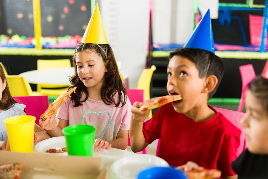 The birthday party was held at the birthday boy's favorite pizza place. 