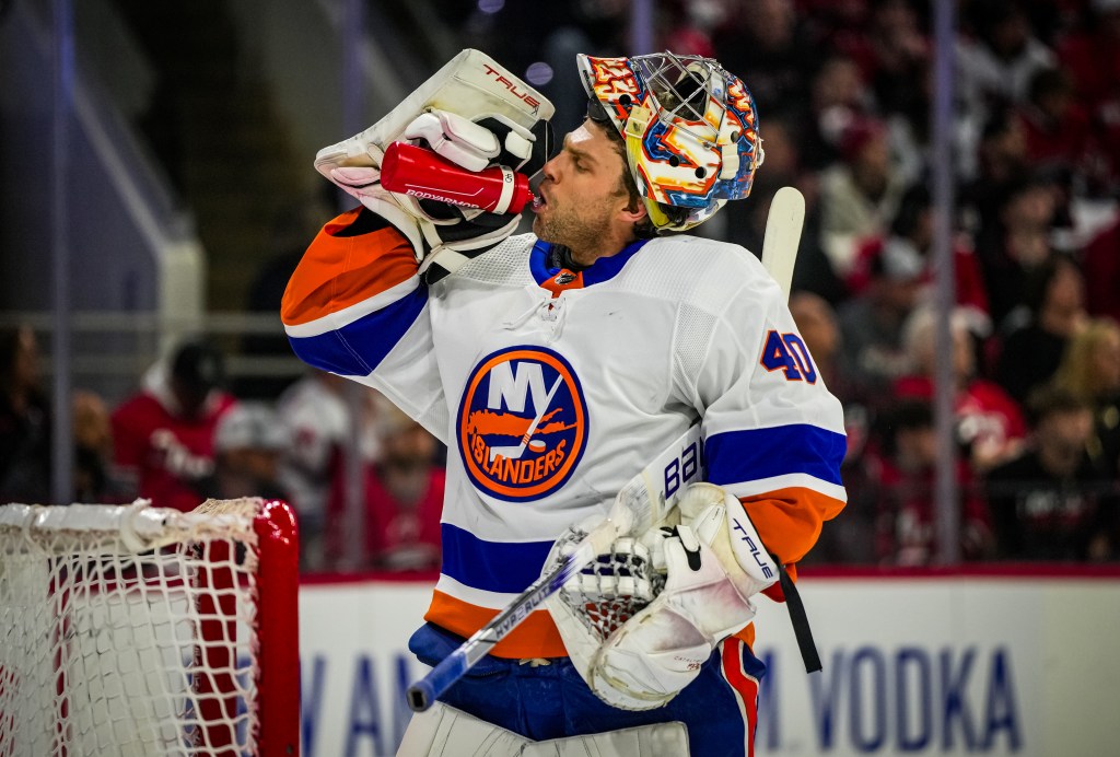 Semyon Varlamov takes a drink of water during a stoppage in the Islanders' 5-3 Game 2 loss to the Hurricanes.