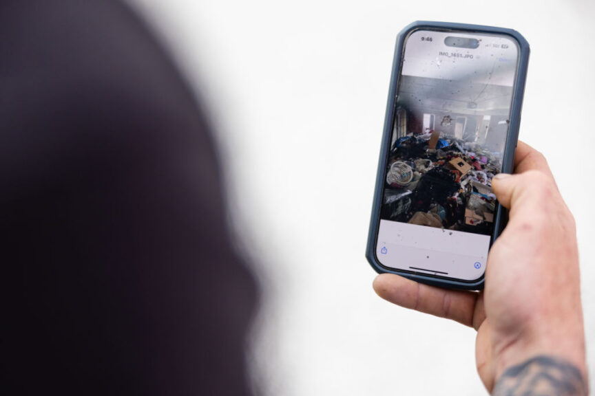 Waste piled up on a property, occupied illegally, on a smartphone of a worker at a cleaning company in Atlanta, Georgia, US, on Friday, Nov. 17, 2023. An estimated 1,200 homes are illegally occupied in the Atlanta metro area, an epicenter for institutional investors. Photographer: Elijah Nouvelage/Bloomberg via Getty Images