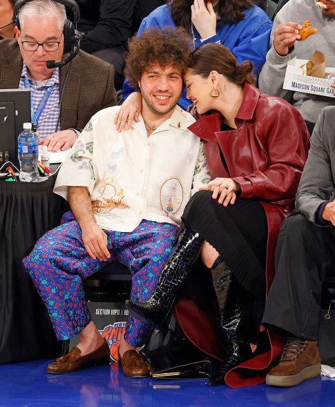 COURT JESTERS: Selena Gomez keeps her eyes on boyfriend Benny Blanco while he’s got eyes on the New York Knicks at Madison Square Garden.