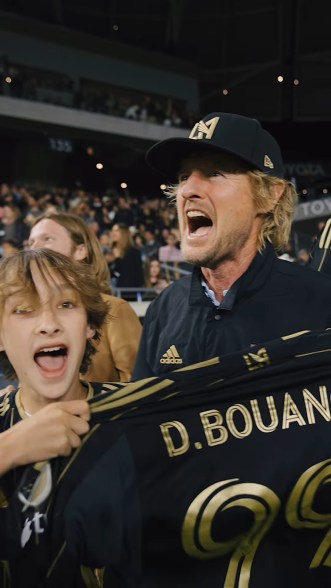 GOAL MINE: In Los Angeles, Owen Wilson (right) and son Robert, 13, celebrate the home team’s tie with the New York Red Bulls.