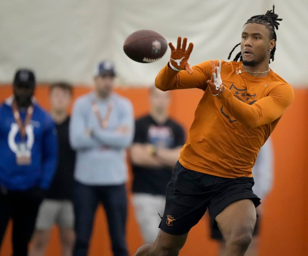 Wide receiver Adonai Mitchell goes through drills at Texas Longhorns Football Pro Day.