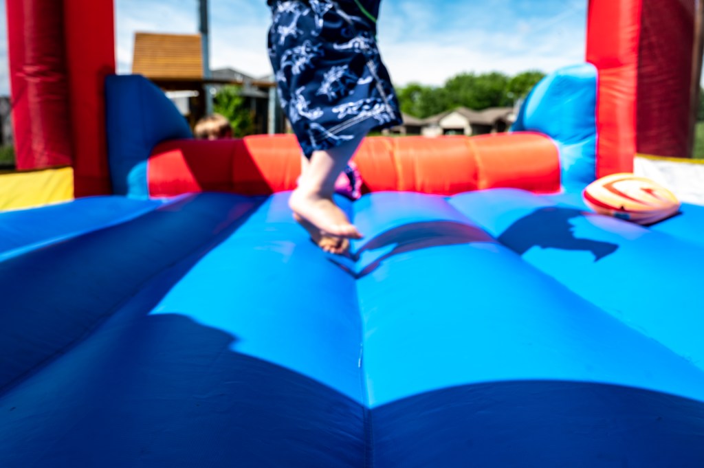 The giant inflatable went airborne around 5 p.m. with several children, including the tot, inside.