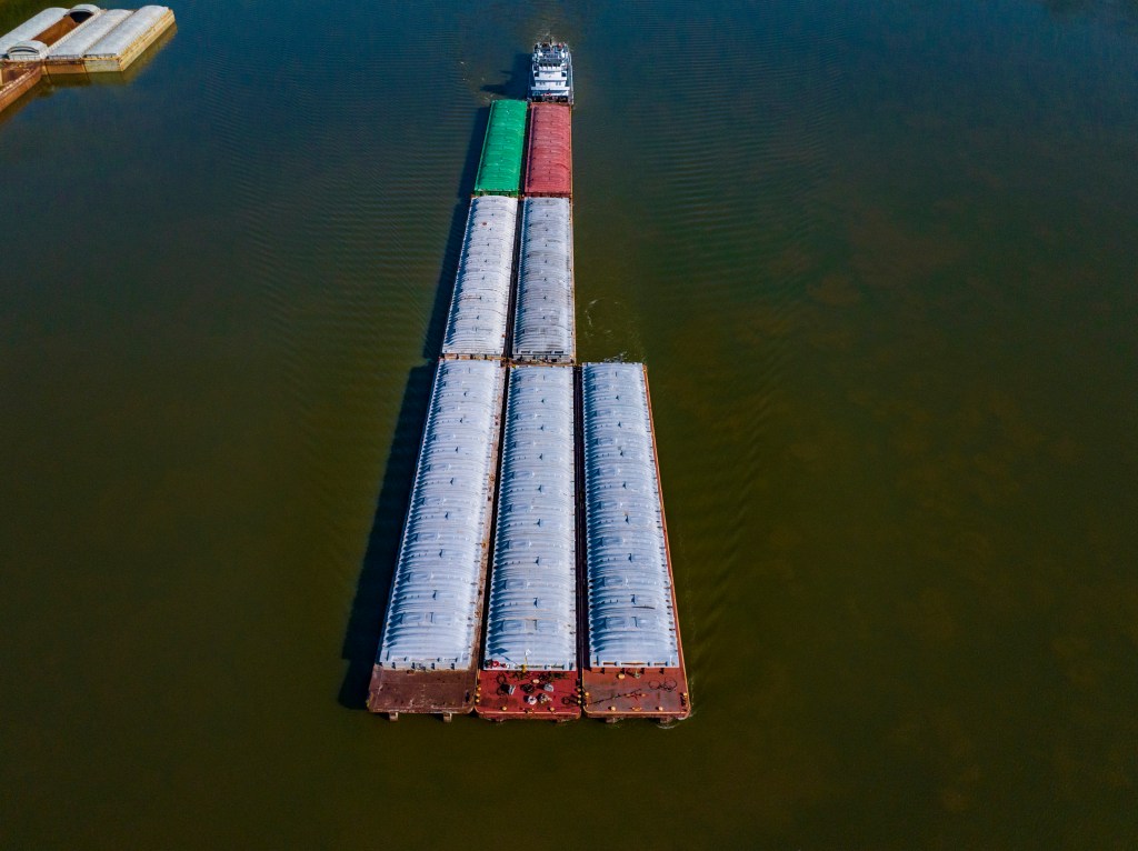 Cargo river barge floating down the Ohio River.