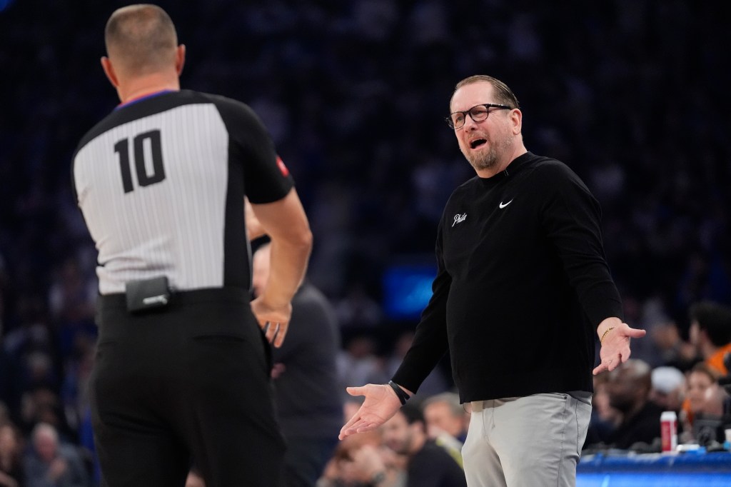 76ers' Nick Nurse argues a call with referee John Goble (10) during the first half of Game 2.