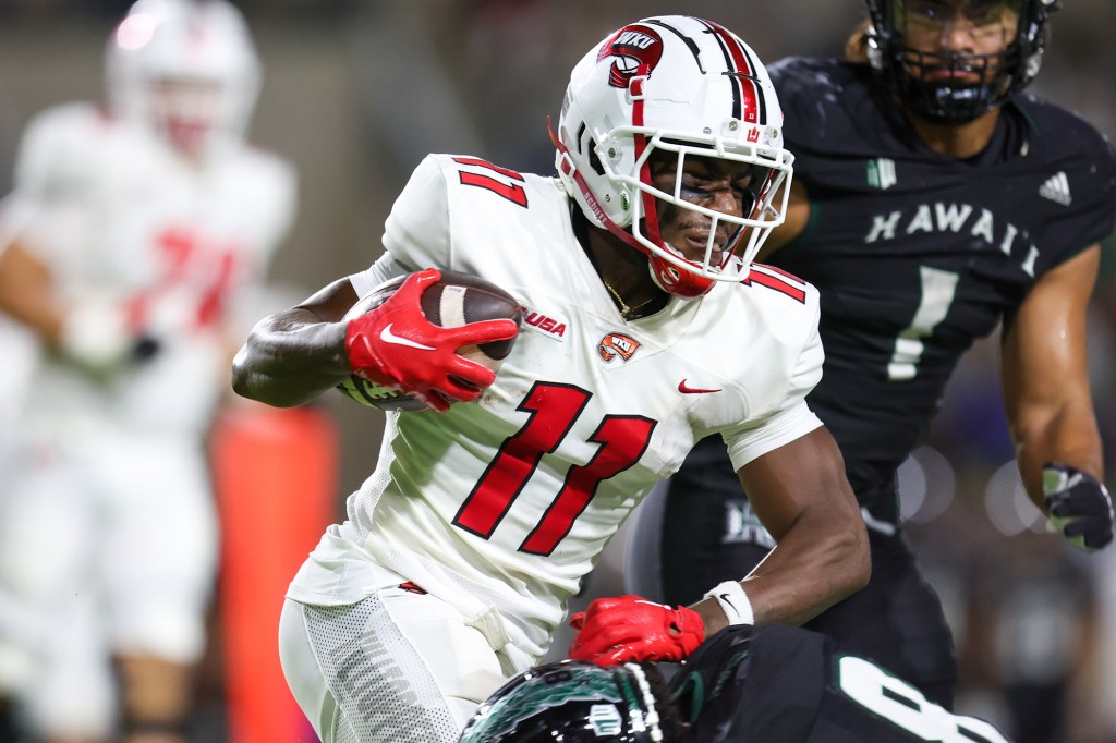 Malachi Corley #11 of the Western Kentucky Hilltoppers runs the ball during the second half of an NCAA football game against the Hawaii Rainbow Warriors at the Clarance T.C. Ching Athletic Complex on September 3, 2022 in Honolulu, Hawaii.