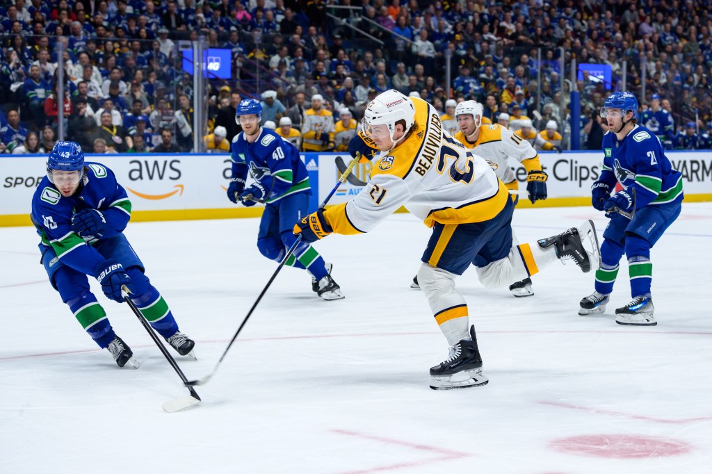 Quinn Hughes #43 of the Vancouver Canucks defends against Anthony Beauvillier #21 of the Nashville Predators during the second period in Game Two of the First Round of the 2024 Stanley Cup Playoffs at Rogers Arena on April 23, 2024 in Vancouver, British Columbia, Canada.