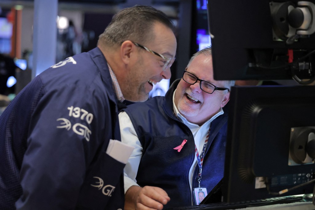 New York Stock Echange traders smile