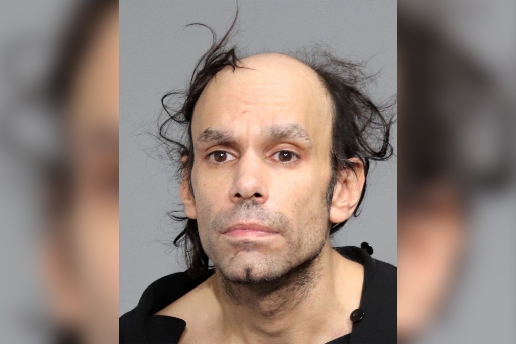 A mugshot photo of a man arrested for carrying a machete