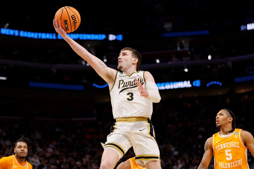 Braden Smith #3 of the Purdue Boilermakers goes for the basketball against the Tennessee Volunteers during the Elite Eight round of the 2024 NCAA Men's Basketball Tournament.