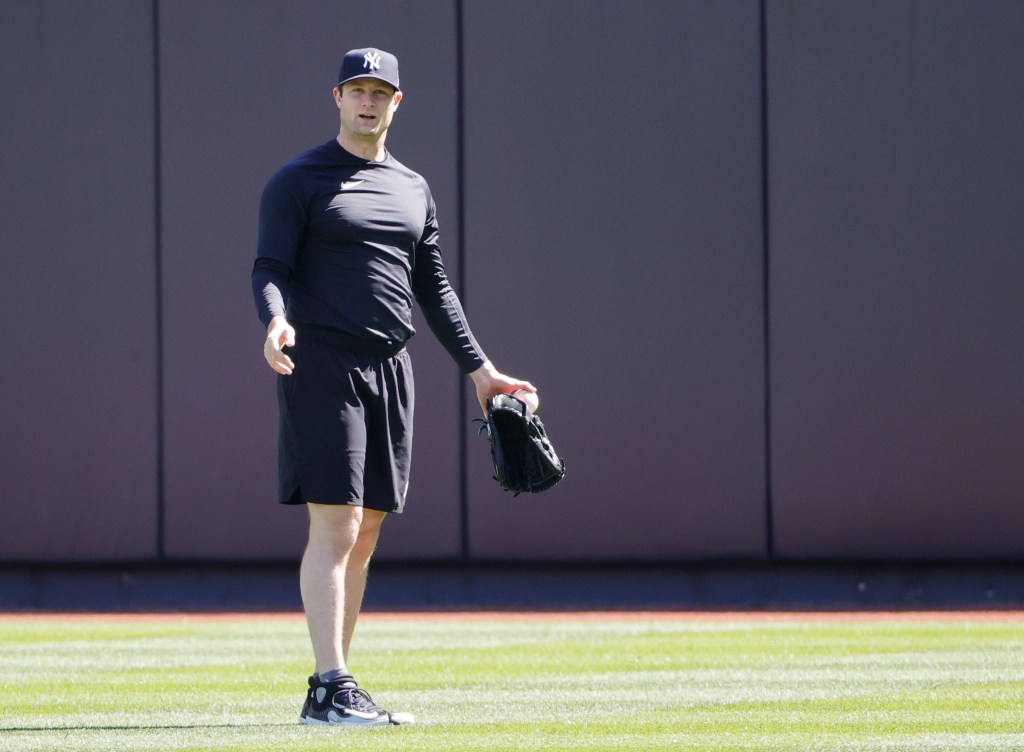 Yankees starting pitcher Gerrit Cole reacts in the outfield during his rebab before the start of his teams game against the Oakland A's on Tuesday,