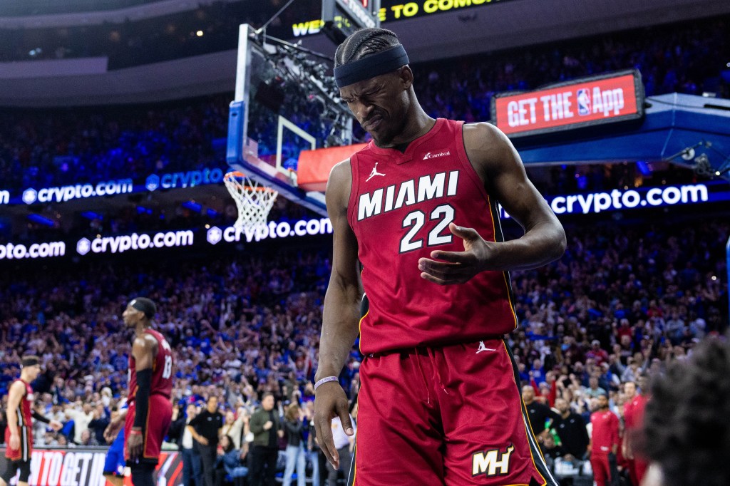 Miami Heat forward Jimmy Butler (22) reacts after a collision during the fourth quarter against the Philadelphia 76ers