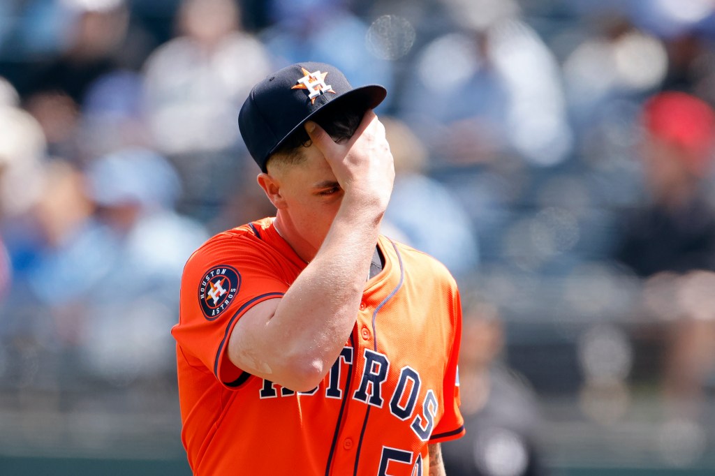 Houston Astros pitcher Hunter Brown looking frustrated after Kansas City Royals score two runs in the first inning of a baseball game