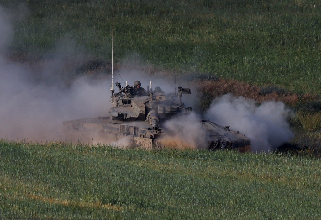 An Israeli tank manoeuvres near the Israel-Gaza border, amid the ongoing conflict between Israel and the Palestinian Islamist group Hamas, in southern Israel, April 2, 2024. 