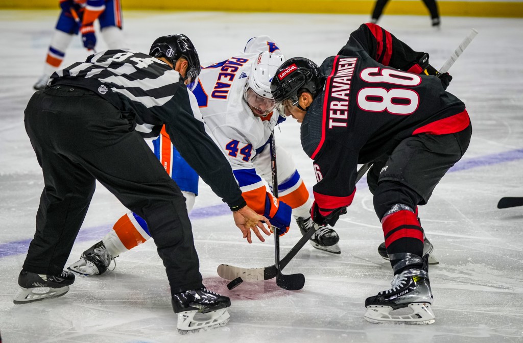 Teuvo Teravainen #86 of the Carolina Hurricanes faces off against Jean-Gabriel Pageau #44 of the New York Islanders during the second period in Game Two of the First Round of the 2024 Stanley Cup Playoffs.