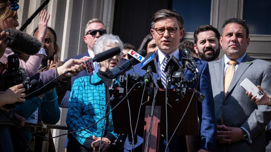 Speaker Mike Johnson talks to the media at Columbia University.