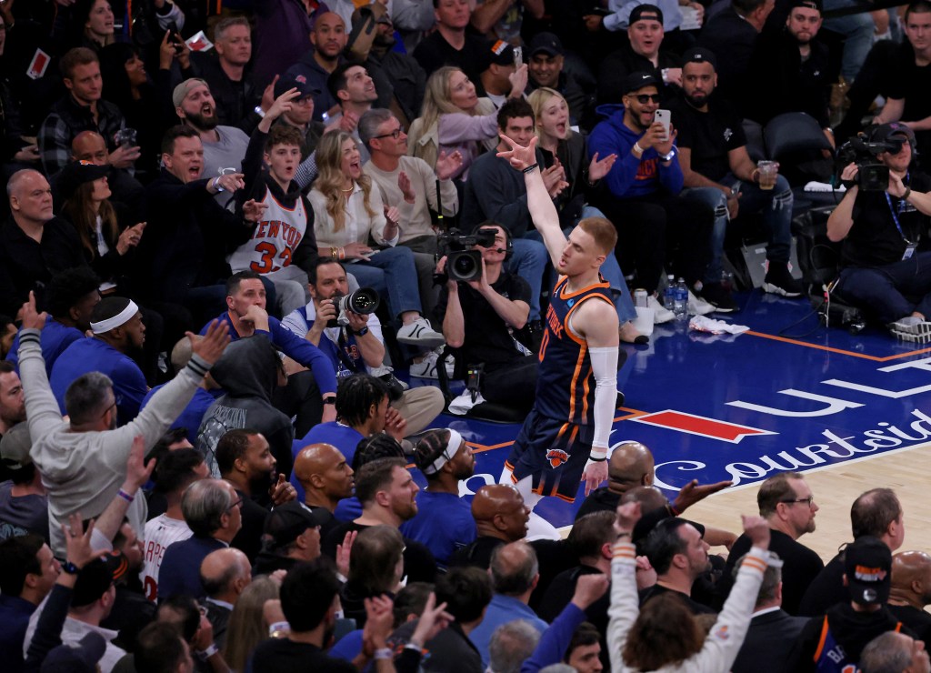 Fans erupt as New York Knicks guard Donte DiVincenzo #0 celebrates hitting a three point shot during the third quarter.