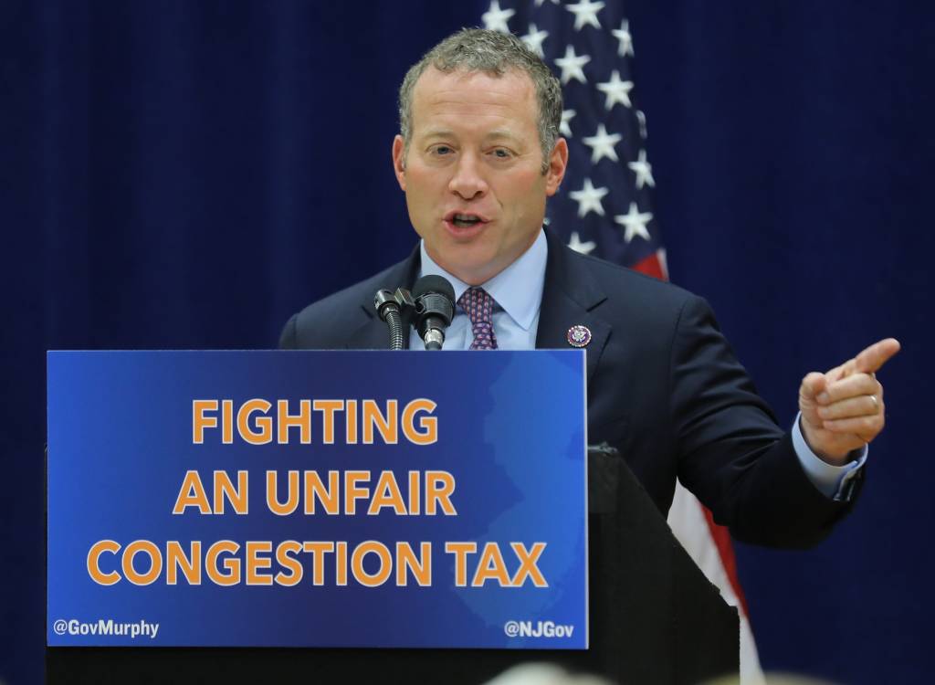 Rep. Josh Gottheimer spoke as New Jersey Governor Phil Murphy signed a bill with the support of a delegation of politicians representing the Garden State, who came to Fort Lee to announce a lawsuit against the city of New York for imposing a congestion tax