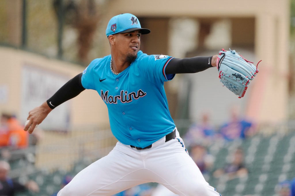 Miami Marlins pitcher Eury Perez in action during a spring training baseball game, throwing a ball