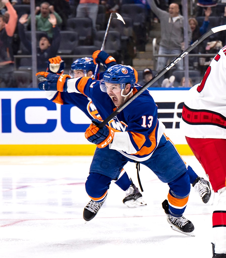 Mathew Barzal #13 of the New York Islanders reacts after he tips in the puck for the game winning goal in double overt time. 