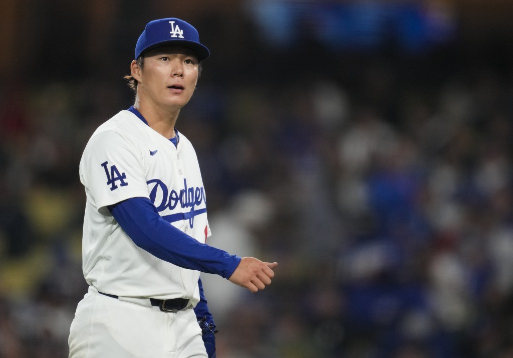 Yoshinobu Yamamoto, who allowed four runs in six innings, walks to the dugout during the Mets' 9-4 win over the Dodgers.