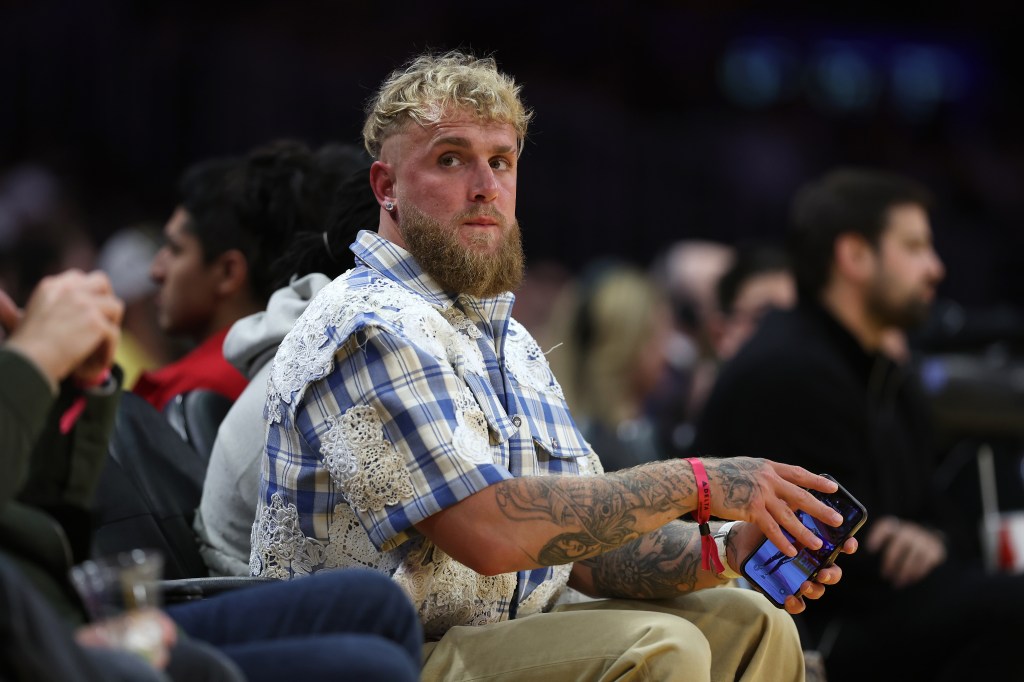 Boxer Jake Paul looks on during the first half of a game between the Los Angeles Lakers and the Milwaukee Bucks at Crypto.com Arena on March 08, 2024 in Los Angeles, California. 