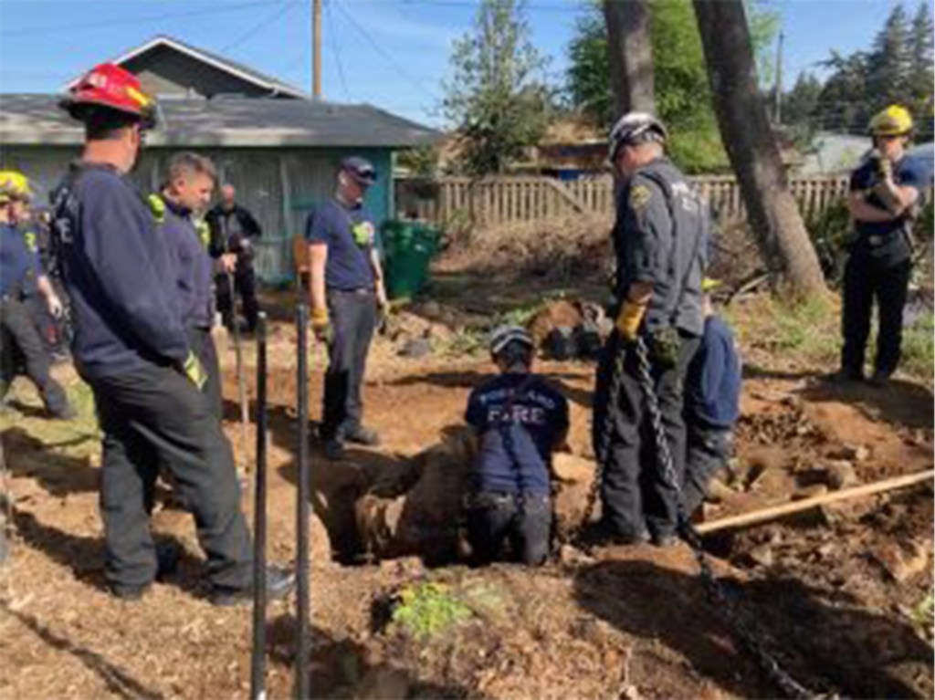 Portland Fire and Rescue are seen responding to the scene.