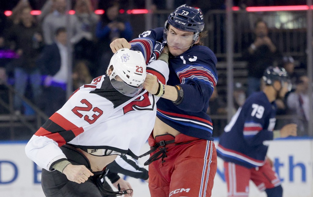 Matt Rempe (right) fights Kurtis MacDermid a few seconds into the Rangers' 4-3 win over the Devils.