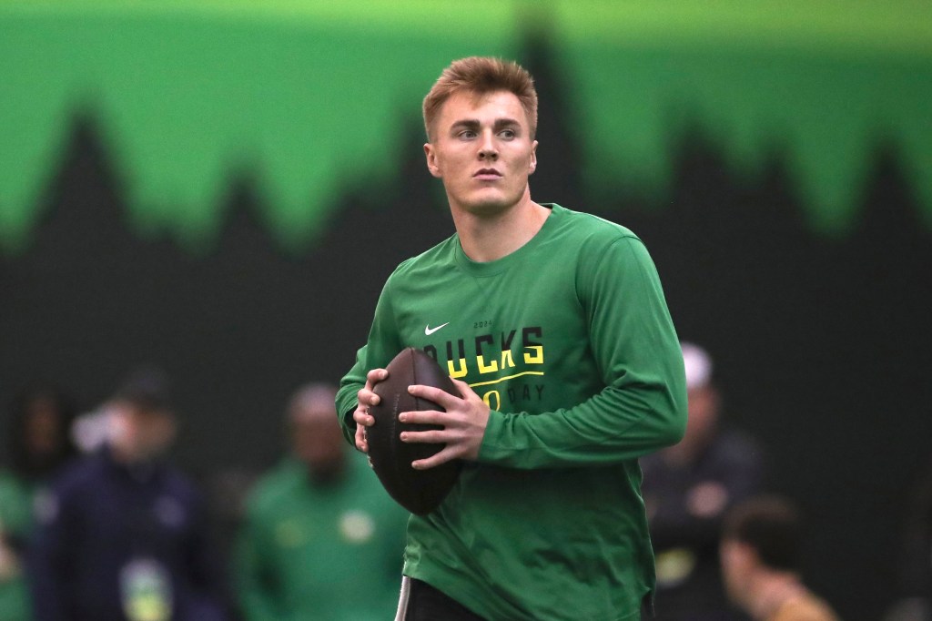 Oregon quarterback Bo Nix warms up before a position drill at the school's NFL Pro Day, Tuesday, March 12, 2024, in Eugene, Ore.