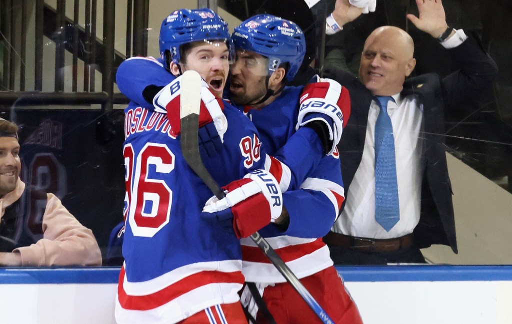 Jack Roslovic (left) is hugged by Erik Gustafsson after scoring a power play goal during the Rangers' 4-3 Game 2 win over the Capitals.