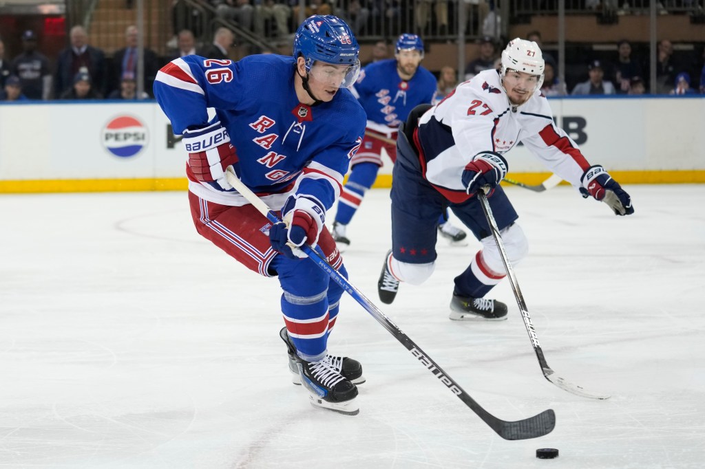 Jimmy Vesey skates with the puck during the Rangers' Game 1 win over the Capitals on April 21, 2024. 