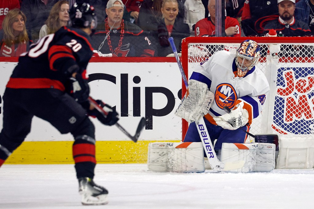 Islanders goaltender Semyon Varlamov (40) catches the shot of Carolina Hurricanes' Sebastian Aho (20) during the first period in Game 2 of an NHL hockey Stanley Cup first-round playoff series.