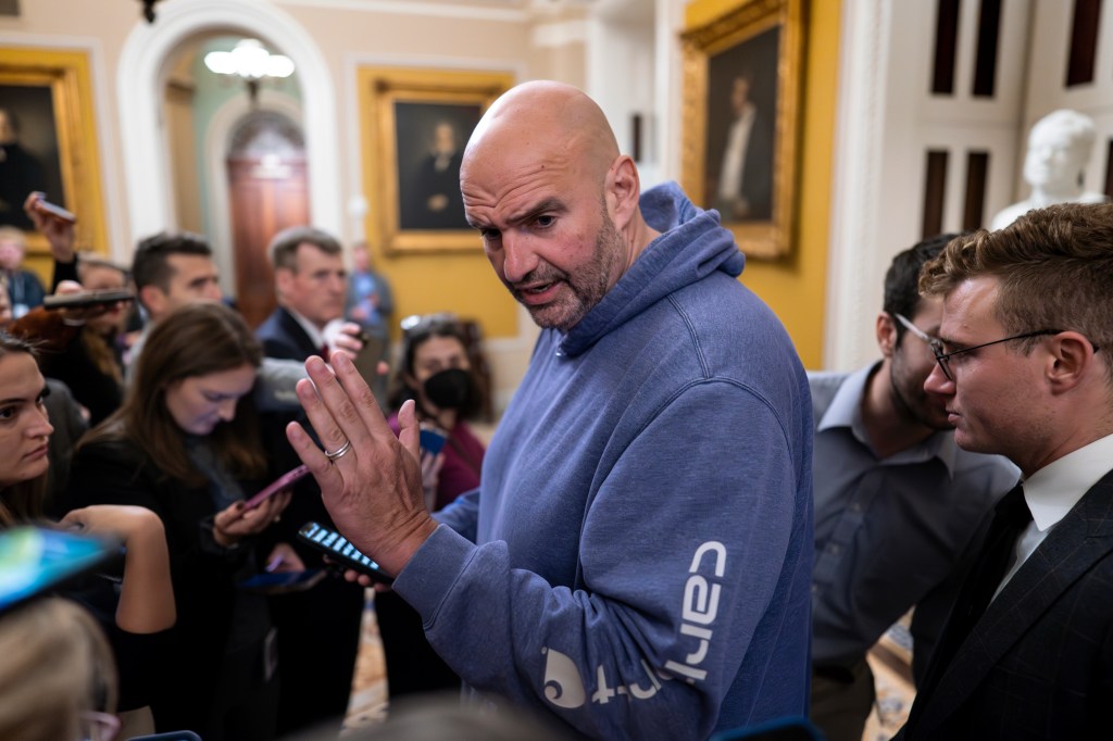 Senator John Fetterman speaking to reporters outside a closed-door meeting of the Senate Democratic Caucus at the Capitol in Washington