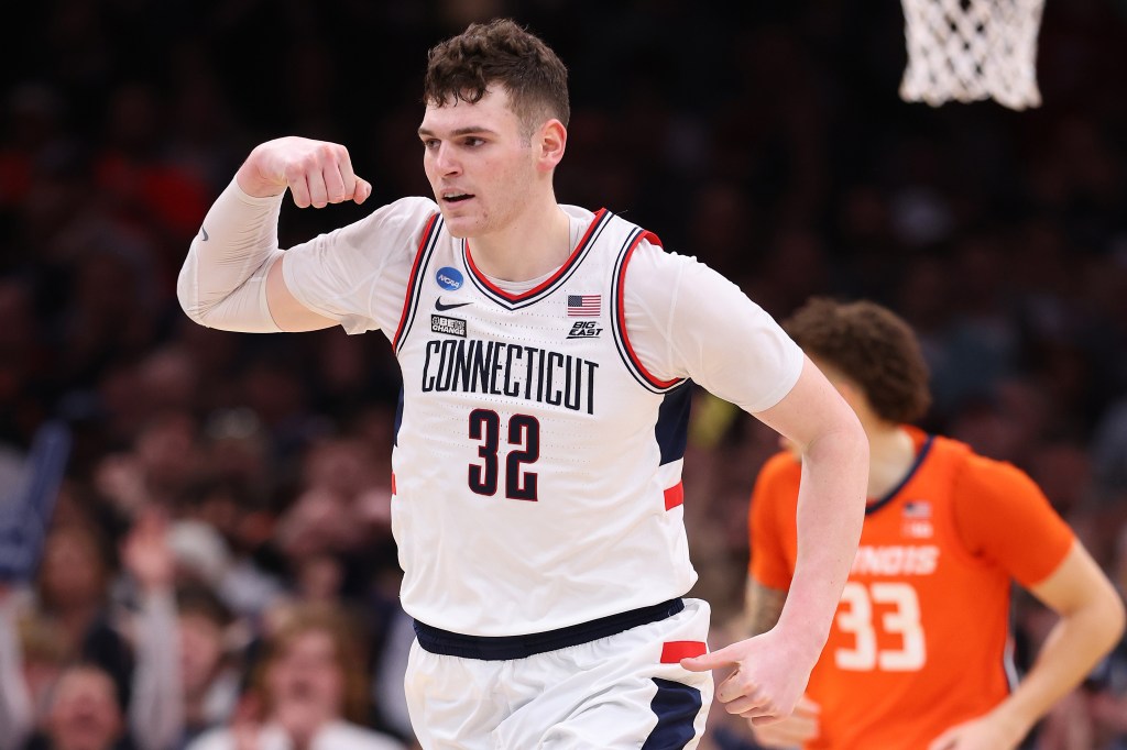 Donovan Clingan #32 of the Connecticut Huskies reacts against the Illinois Fighting Illini during the second half in the Elite 8 round of the NCAA Men's Basketball Tournament.