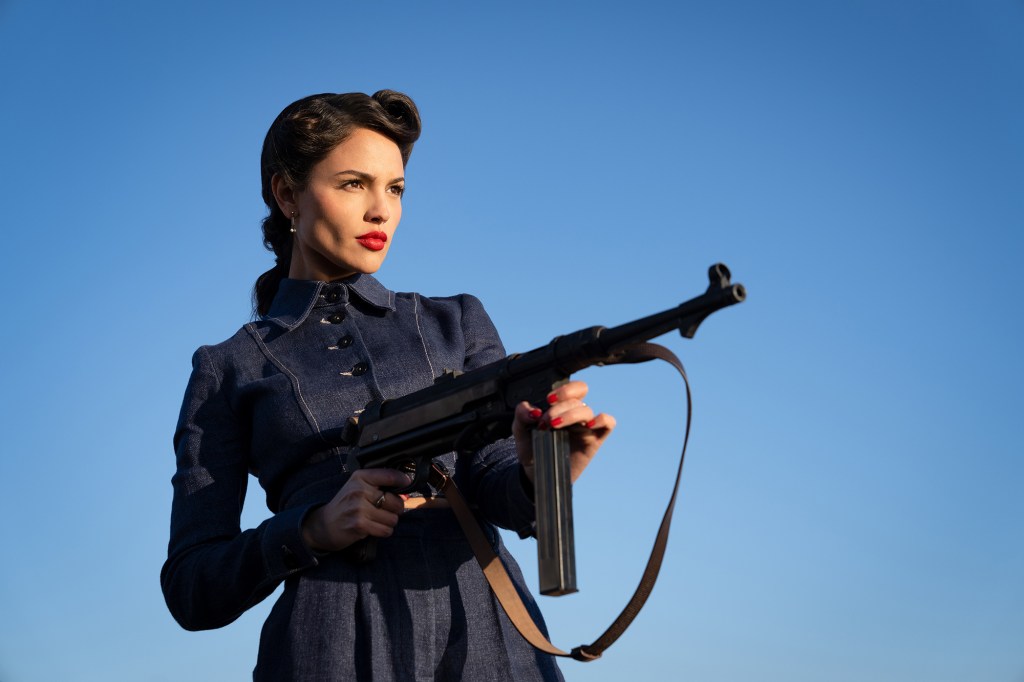 Eiza González Rivera holding a gun in a film still from 'The Ministry of Ungentlemanly Warfare'