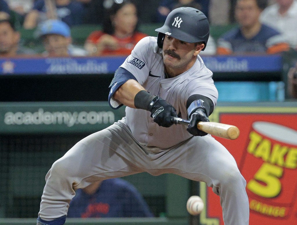 Yankees catcher Austin Wells, attempting a bunt earlier in the season, has struggled at the plate thus far this season.