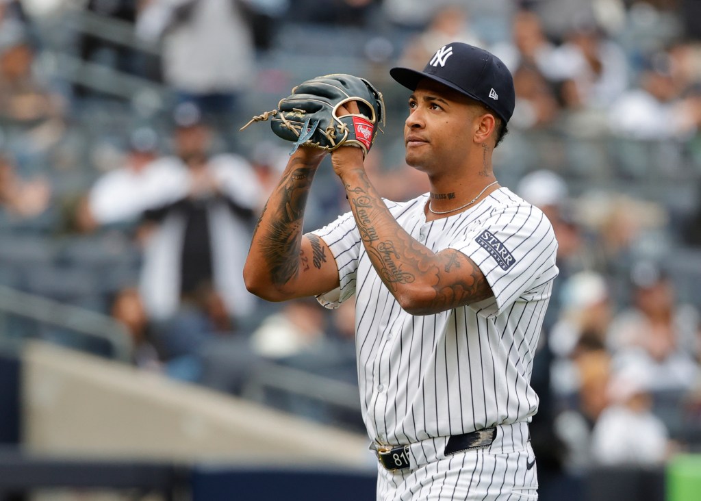 Yankees starter Luis Gil reacts to the fans cheers after he was taken out in the sixth inning against the Tampa Bay Rays on Sunday. 