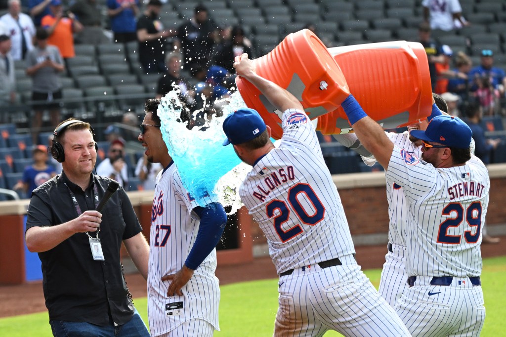 Mark Vientos get a Gatorate dump from Pete Alonzo and other Mets after his game-winning homer on Sunday against the Cardinals.