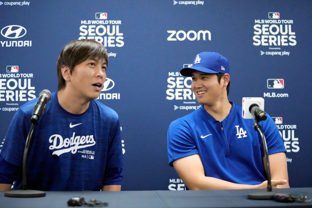 Los Angeles Dodgers' Shohei Ohtani, right, and his interpreter, Ippei Mizuhara, attend at a news conference ahead of a baseball workout at Gocheok Sky Dome in Seoul, South Korea, Saturday, March 16, 2024.