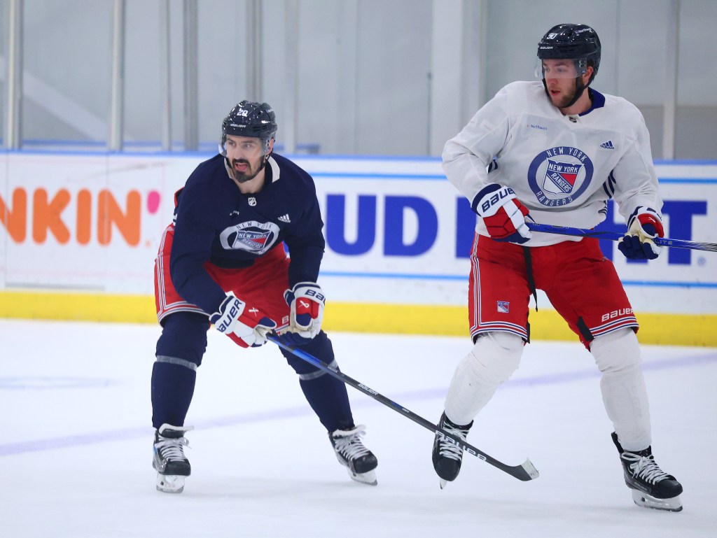 Chris Kreider (left) and Matt Rempe skate during Rangers practice on Wednesday.