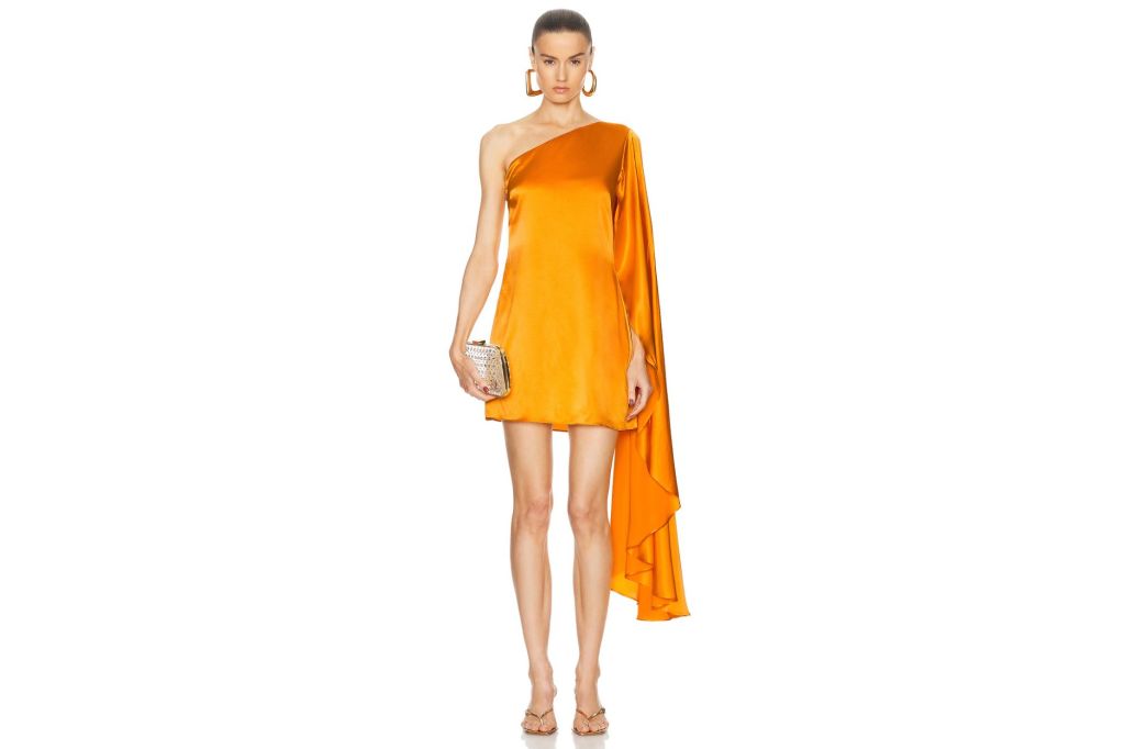 A woman in an orange cocktail dress