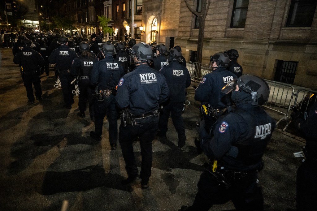 Members of the NYPD prepare to enter Columbia University campus to clear the pro-Palestinian protest encampment and Hamilton Hall where demonstrators barricaded themselves inside on April 30, 2024 in New York City