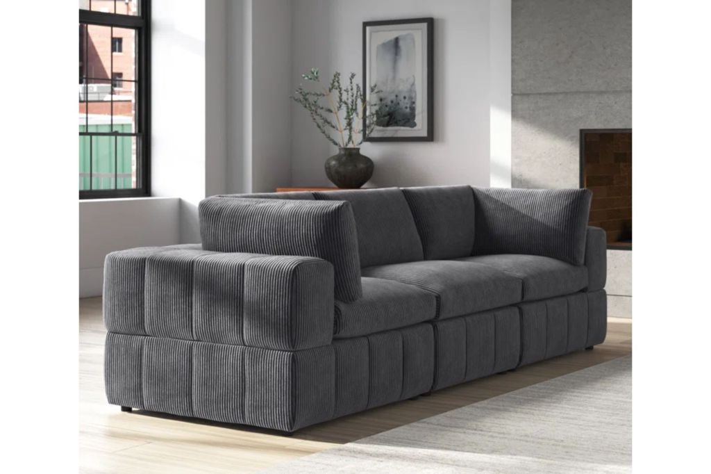 A comfortable couch in the color grey